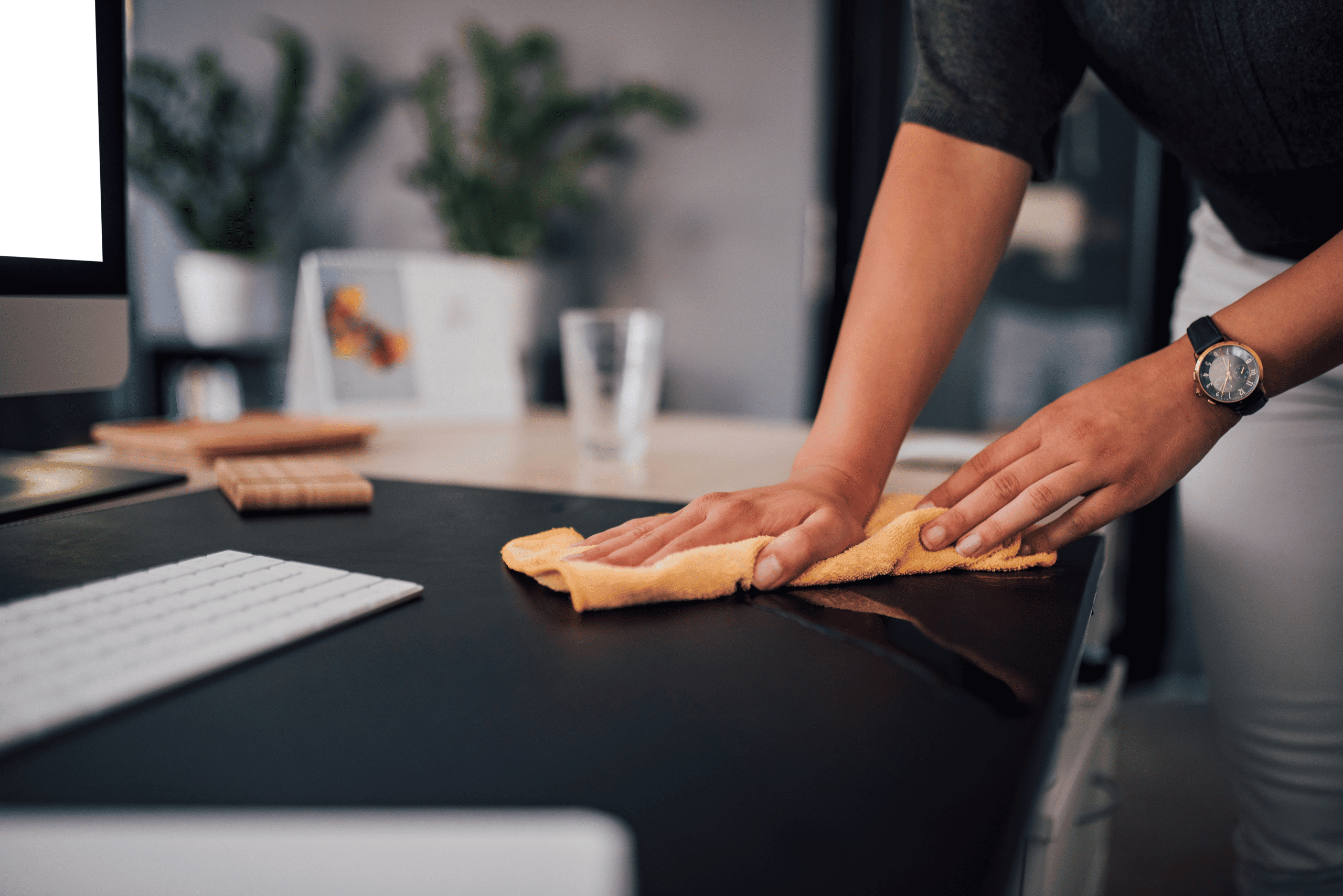 Professional cleaning office desk with cloth