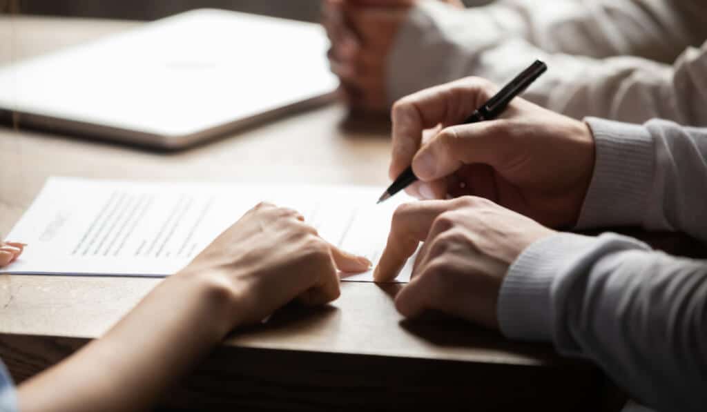 A company signing Insurance papers