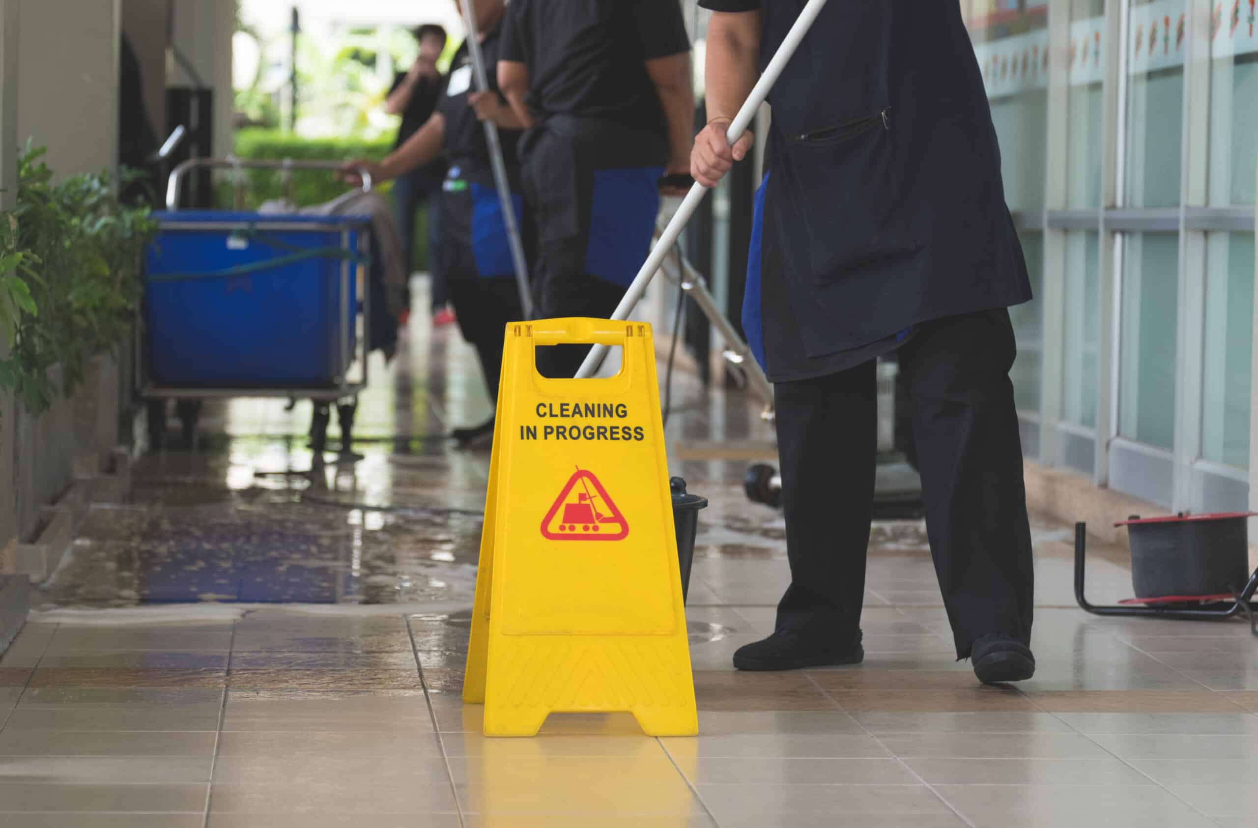 Image of a team of cleaners cleaning the floor of a commercial building