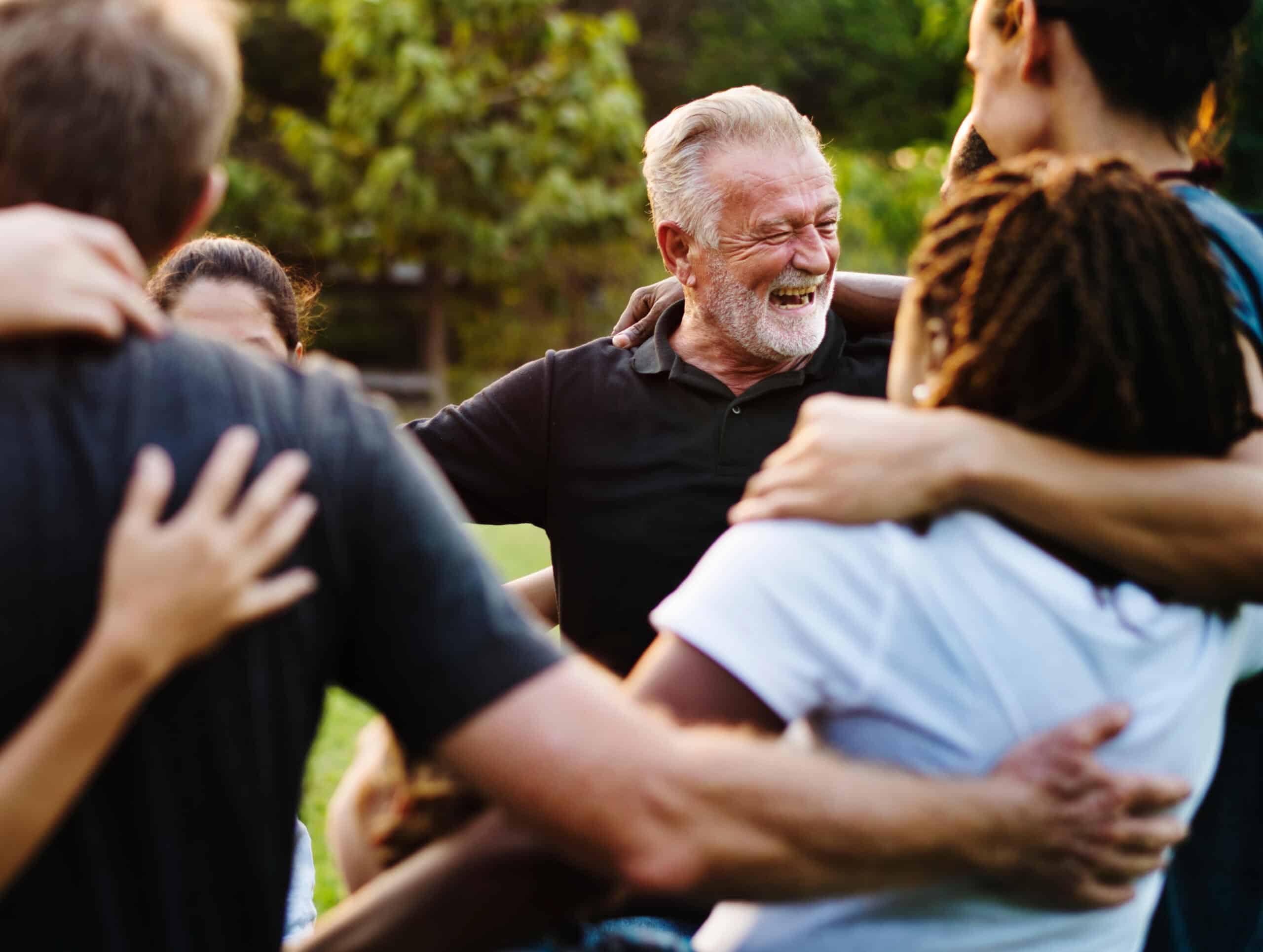 Happiness group of people huddle and smiling together