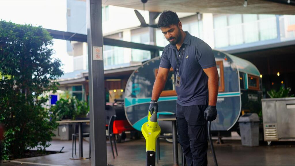 Jani-King cleaner using vacuum cleaner